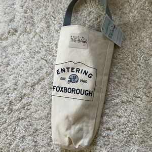 Half in the bag insulated wine bag entering Foxborough. Home of the patriots.